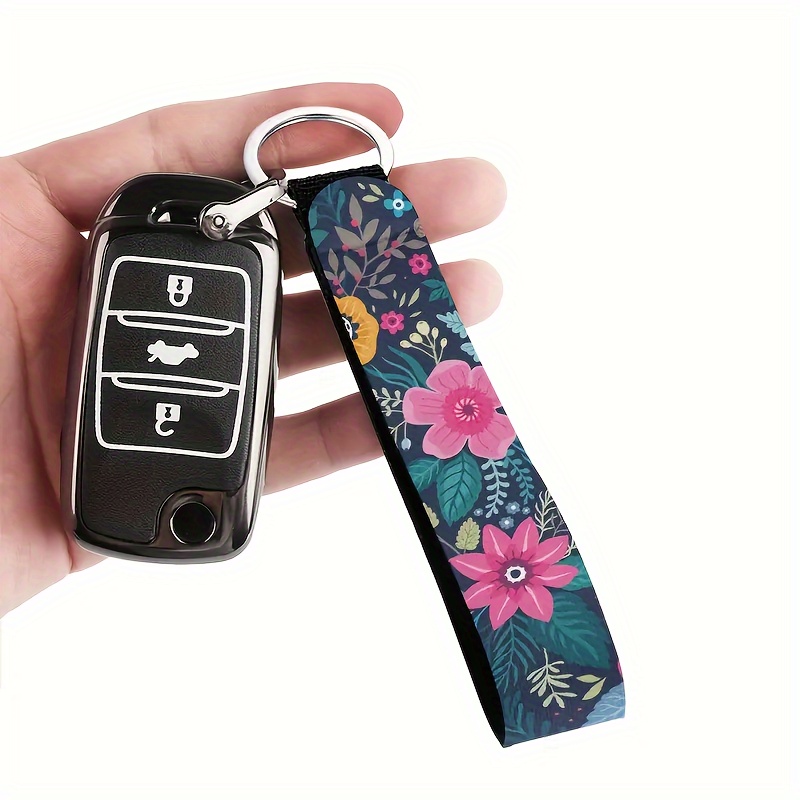 

A Polyester Wristband Keychain With A Floral Pattern, Suitable For Both Men And Women, Can Be Used For Car Keys, Cameras, Backpacks, Phones, And House Keys.