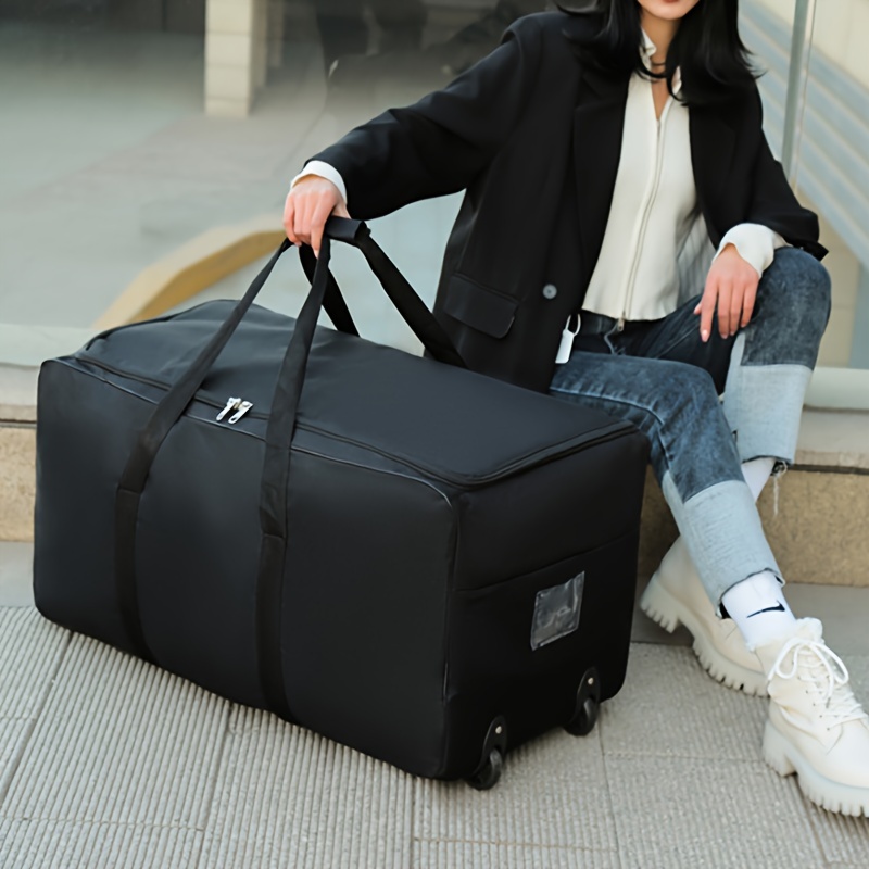 

Spacious Black Nylon Travel Duffle Bag With Smooth Skate Wheels - , Lightweight & Foldable For Effortless Journeying - Large Capacity With Front Zip Pocket