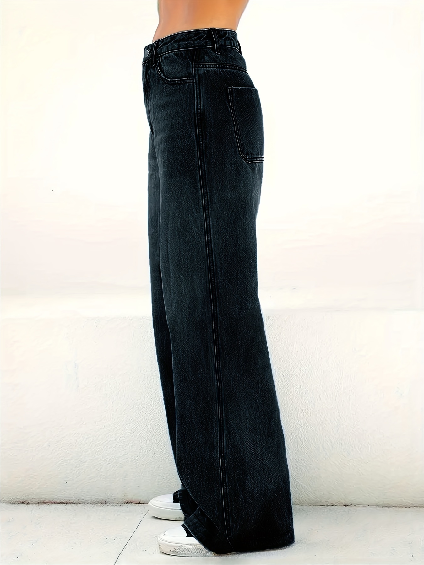 Full length front view of the black washed straight jeans