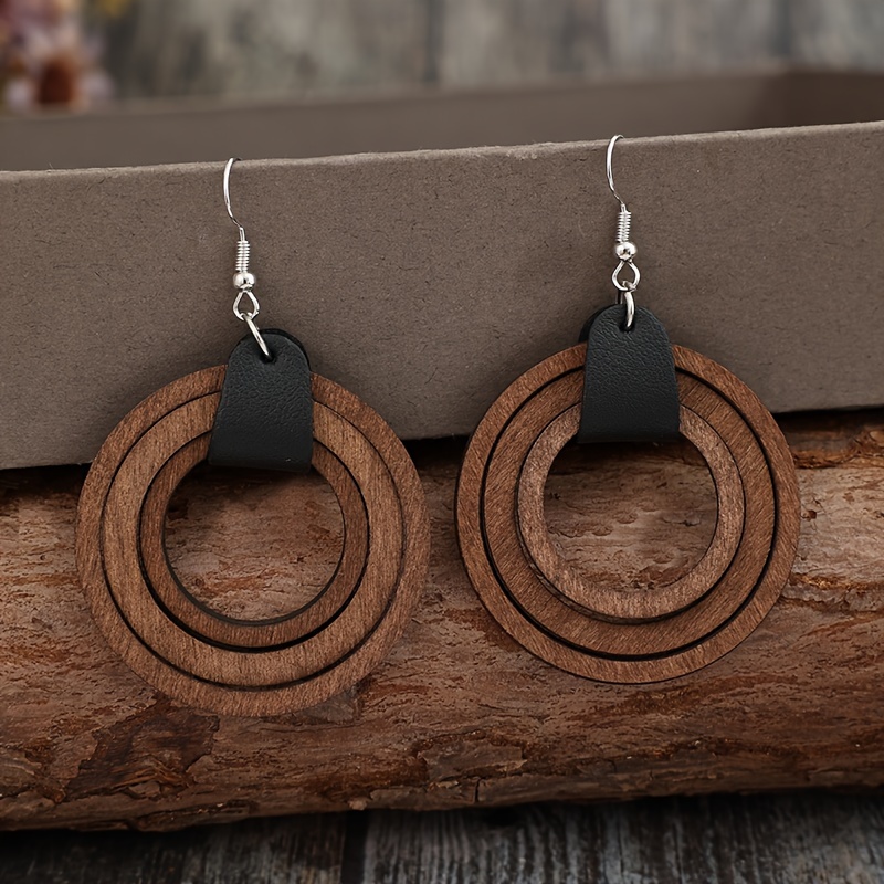 

- Simple Multiple Hollow Round Wooden Ring Splicing Earrings