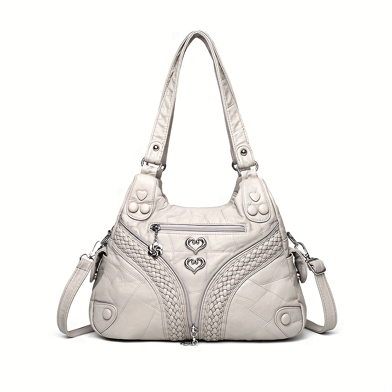 Image of Ladies' Crossbody Bag With A For Woven Faux Leather Motorcycle Style, Featuring Decorations And In 4 Colors. The Motorcycle Button Bag Is Suitable For