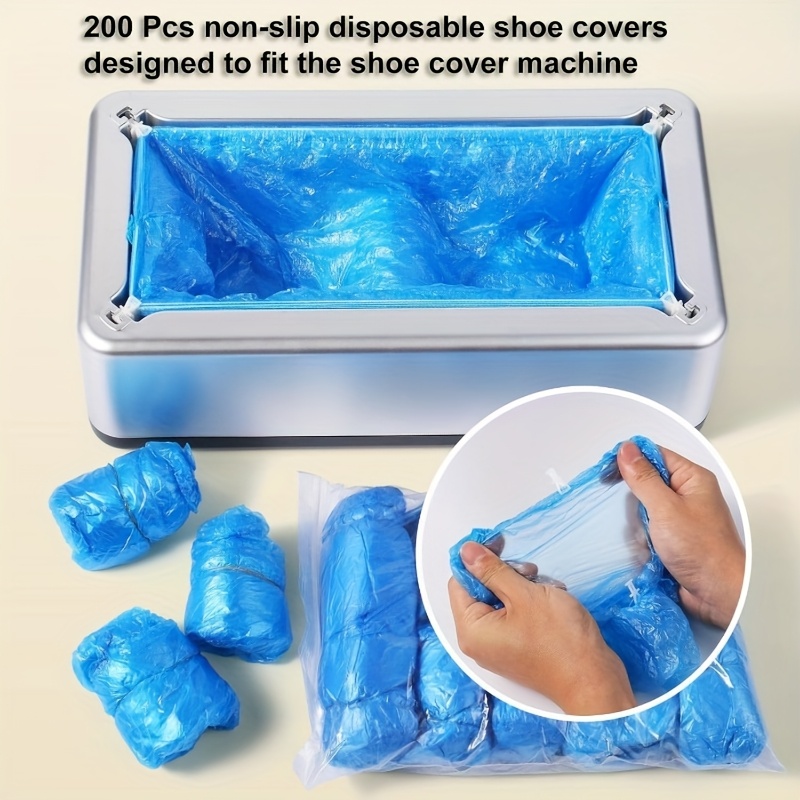 automatic shoe cover dispenser a set of shoe cover machines with 100 disposable plastic boot covers designed to prevent slipping for use in homes shops offices family   and more in a silver color Product details 4