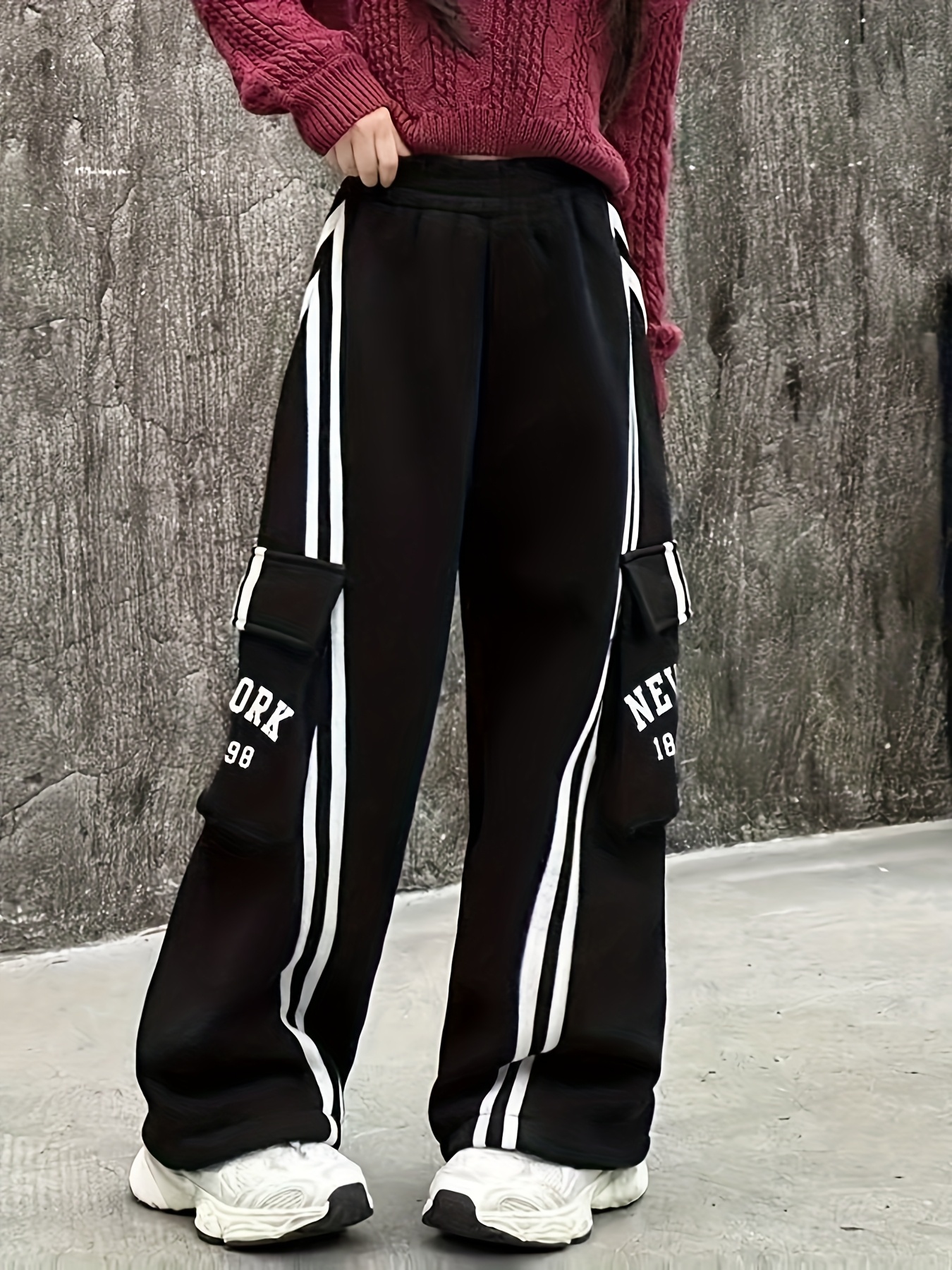 item picture trendy cargo pants for girls made from soft knit material featuring side webbing and an elastic waistband   loose fitting casual trousers come with functional pockets making them ideal for outdoor leisure activities during spring summer