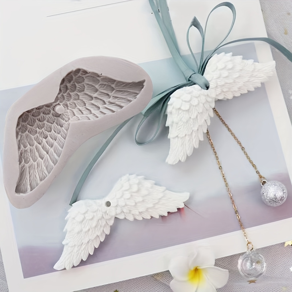 A Silicone Mold For Wing-shaped Aromatic Resin, Featuring Wings And Feather Designs, Suitable For And Decorating Items Like Pendants And Car Air Fresheners