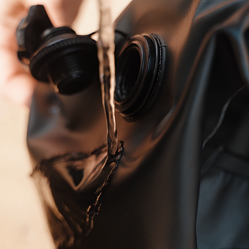 Close-up of a black water weight bag being filling with water