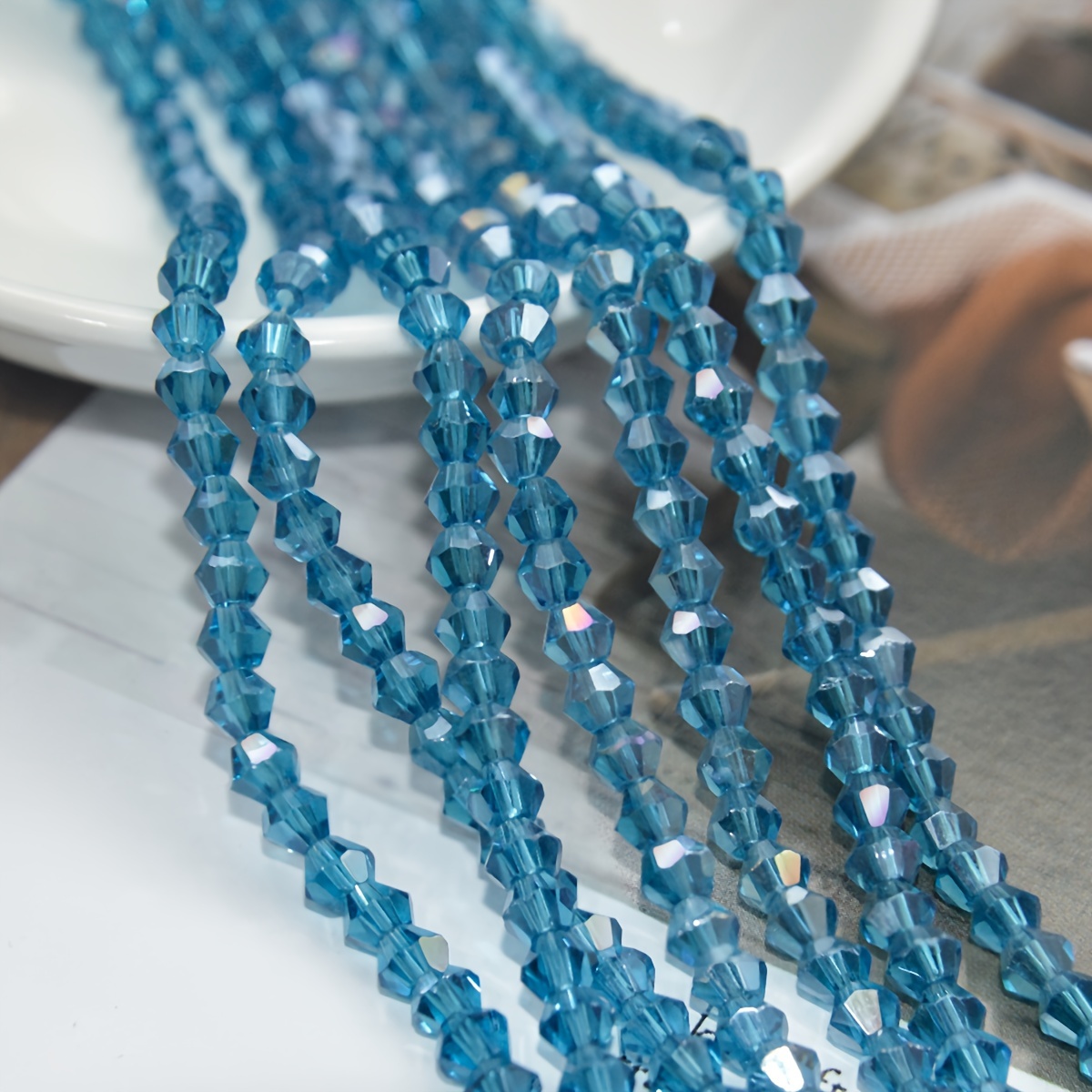 Crystal Faceted Beads On Fishing Wire Necklaces Metallic Peacock