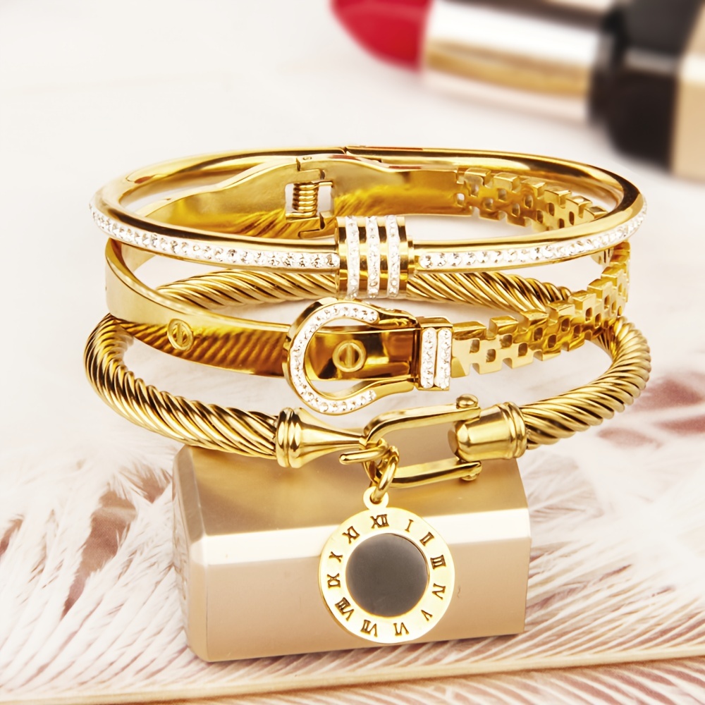 مجموعة من 3 قطع للنساء: سوار سلكي من الفولاذ   للصدأ مطلي بالذهب عيار 18 قيراط مع مشبك حزام وشماعة رومانية وتصميم حجر لامع متعدد المستويات، سوار مجوهرات نسائي للاستخدام في النوادي الليلية والحفلات التفاصيل 0