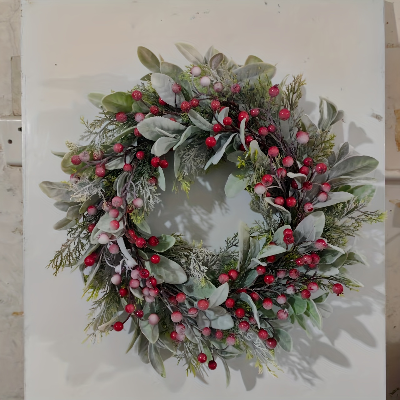 A Festive Wreath For The Front Door Featuring Red Berries And Frosted Leaves, Perfect For Decor, Artificial Lamb's Ear And Evergreen Elements