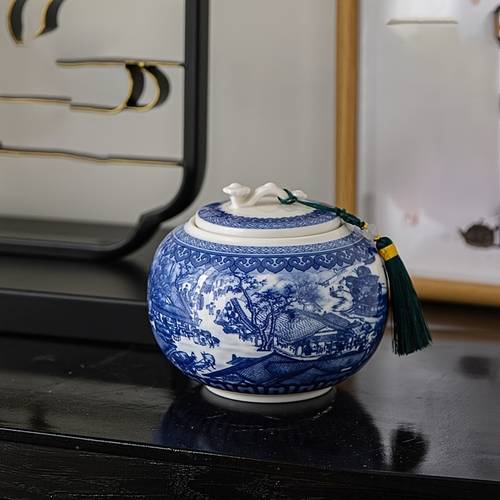 and white ceramic tea canister with traditional chinese design storing tea bags and leaves