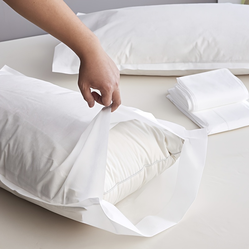 2pcs of   disposable travel pillow covers with sealed envelopes partially cleaned   made of thick breathable non woven polyester suitable for travel hotels and salons unprinted   in a pair use   after opening do not wash details 4