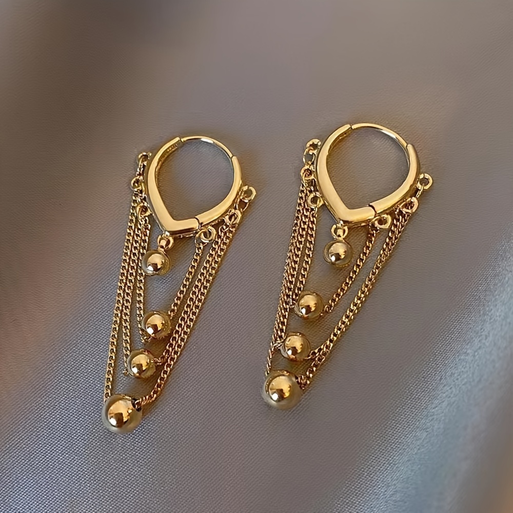 Stylish Tassel Earrings with Golden Sphere Pendant