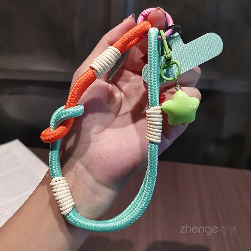 Foto de Strap/correa de mano adaptable a cualquier celular.
