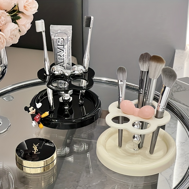 

A Stylish Ceramic Toothbrush Holder, An Electric Toothbrush And Toothpaste Holder For The Washbasin, And A Storage Rack For Eyebrow Pencils And Makeup Brushes.