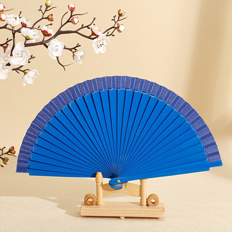 

Classic Spanish Wooden Fan: Elegant And Portable, Perfect For Home Decor