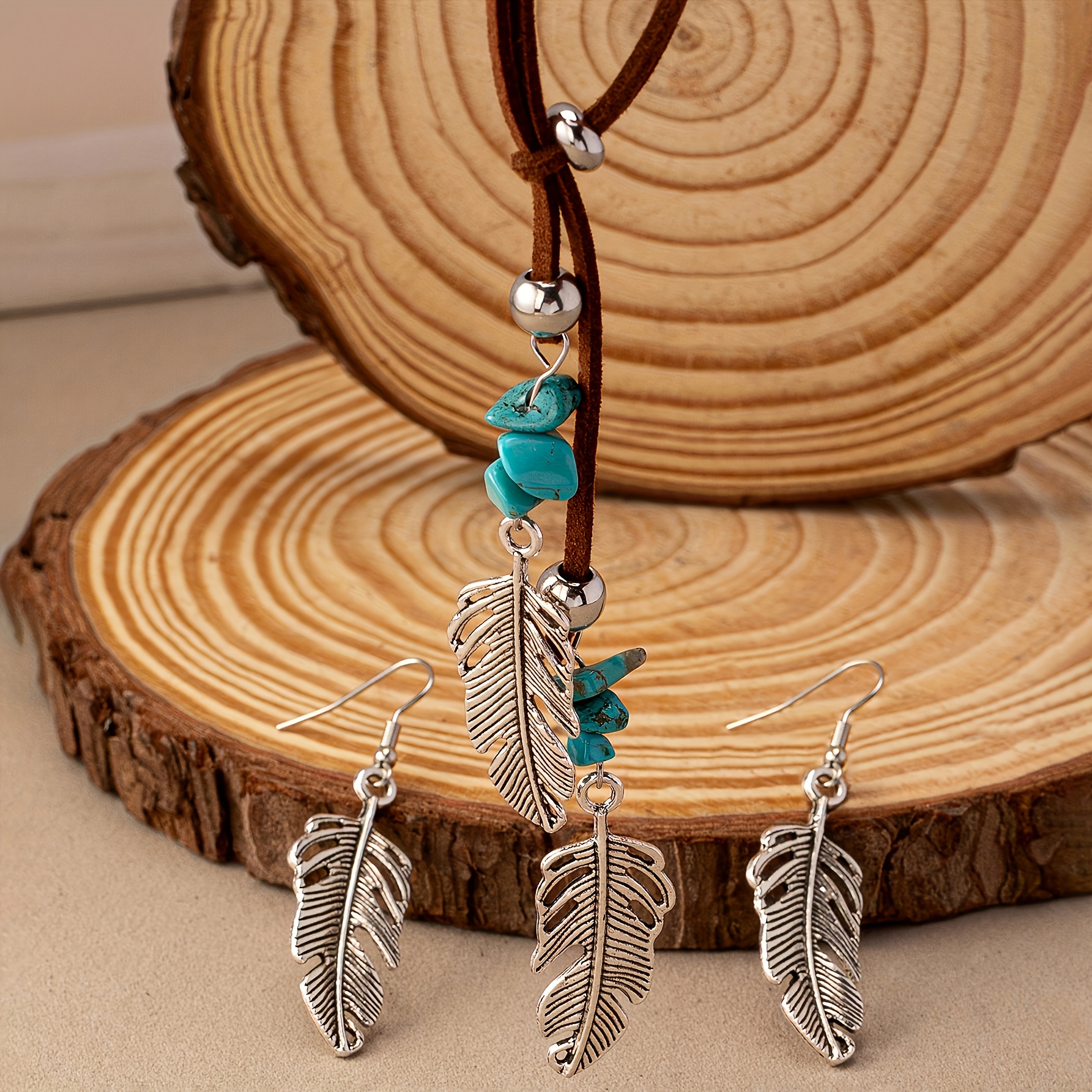Image of A Necklace And A Pair Of Earrings, A Bohemian-style Creative Hollow Leaf Feather Pendant Jewelry Set, Perfect For Vacation And Everyday Wear