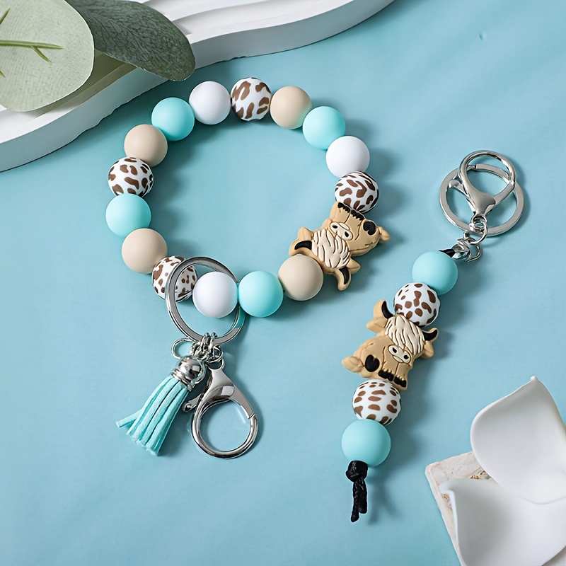 

2pcs/set Of Women's Retro Cartoon Mint Green Yak Silicone Key Pendant, Western Cowboy Style Silicone Bead Bracelet, Keychain, Bag , Tassel Wrist Keychain Accessory, Gift For Friends