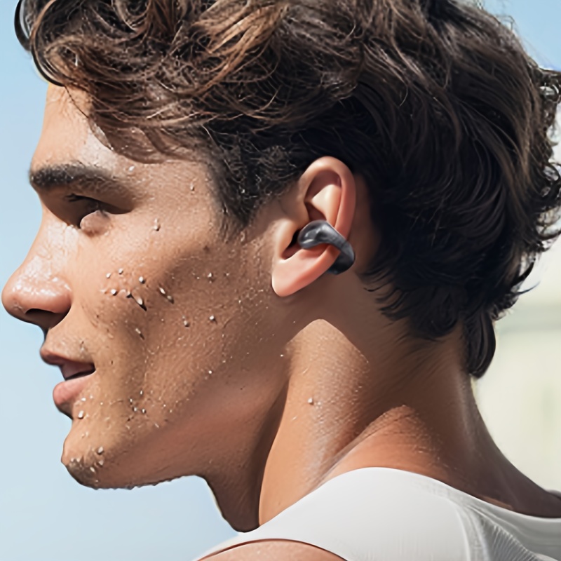 De draadloze oorclip hoofdtelefoon