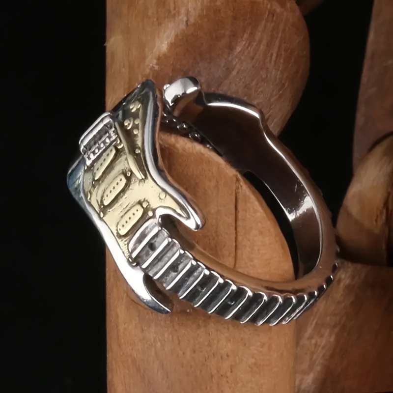 

A Stylish Men's Ring In The Shape Of An Electric Guitar, The Perfect Accessory For Hip-hop And Rock Singers And Guitarists.