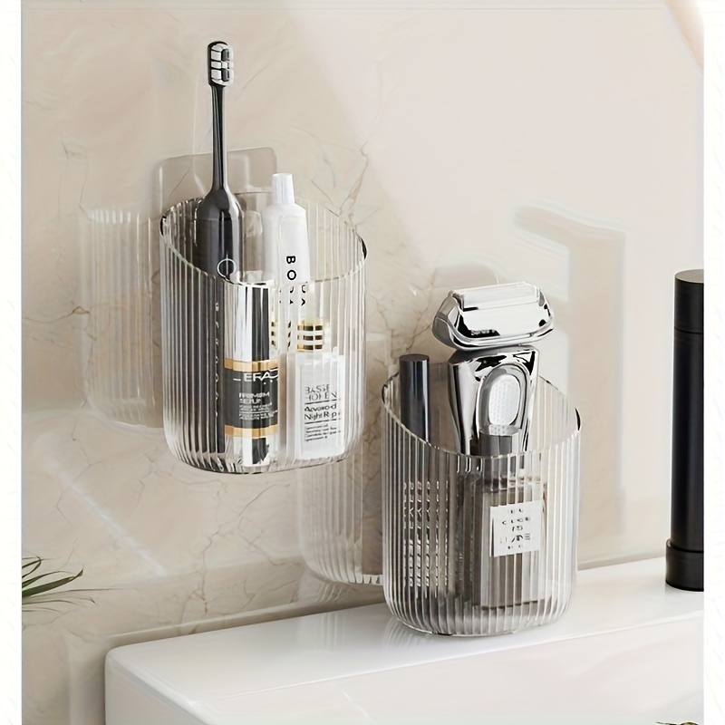 Prie sienos montuojamas puodelio organizatorius – daugiafunkcinė vonios ir virtuvės saugykla, dantų šepetėlių laikiklis, kosmetikos organizatorius, vietą taupanti lentyna, tinkama kriauklei, tualetui, stalviršiui, vonios kambario organizavimui ir saugojimui