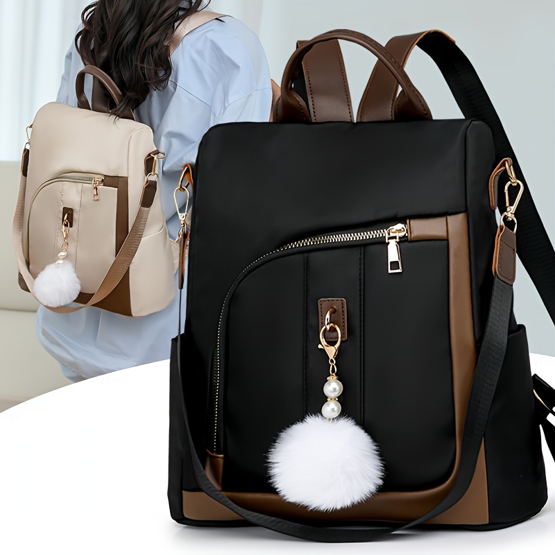 

Vintage Women's Inspired Backpack With Pom-pom Charms - Lightweight Nylon, Adjustable Straps, Zip Closure In Black & With Brown Leather Accents, Backpack For Travel