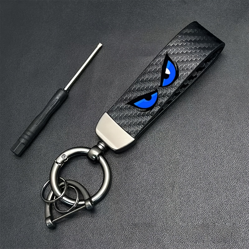 TEMU 1pc Blue Eyeglass Car Keychain Made Of Carbon Fiber, Featuring A Sporty Style And A Decorative Key For Sports Cars. A Durable And Fashionable