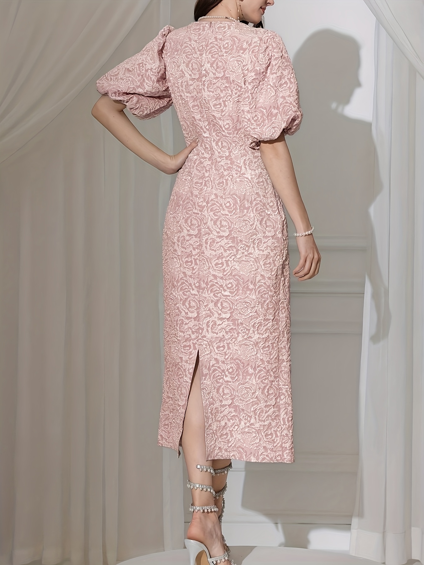 Rosebud Textured Floral Midi Dress in blush pink showcasing puff sleeves and ruffled hem