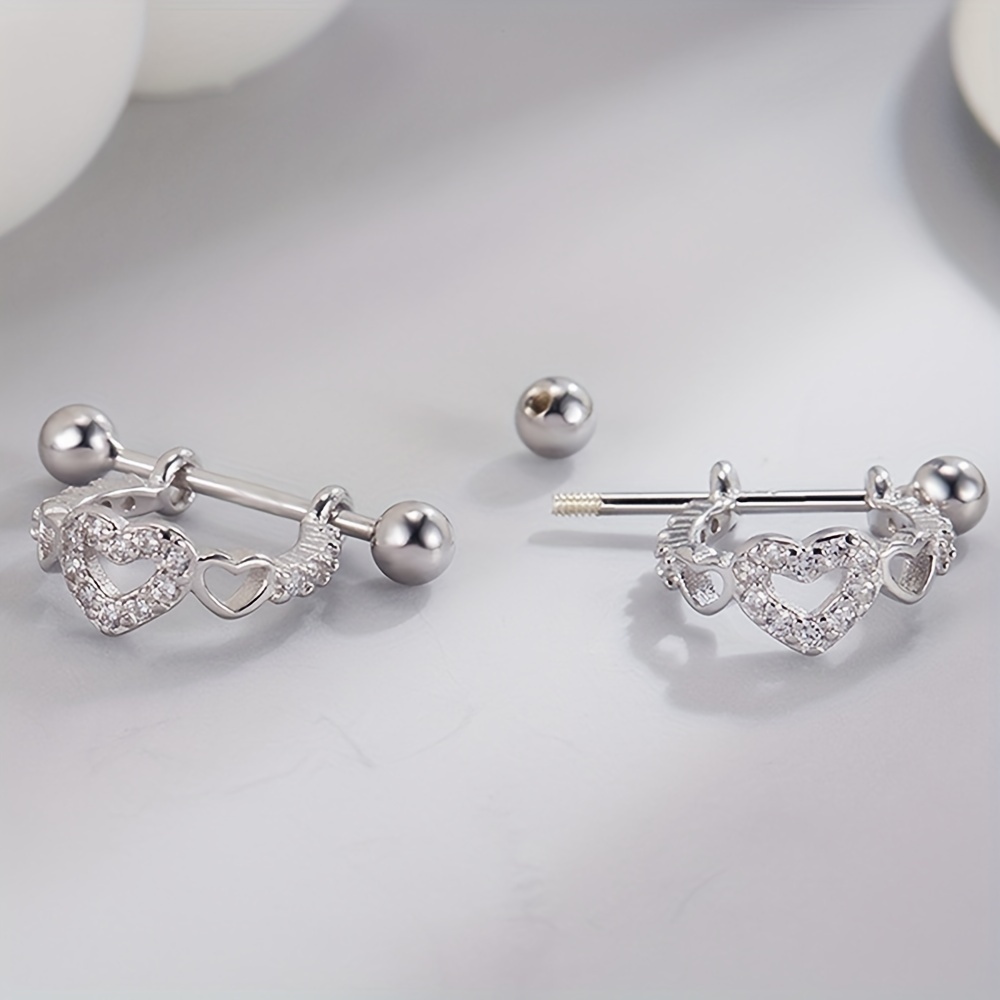 Image of A Pair Of Fashionable, Design-inspired Hollow Heart-shaped Synthetic Zirconia-inlaid Screw-back Ear Studs/ear For Women