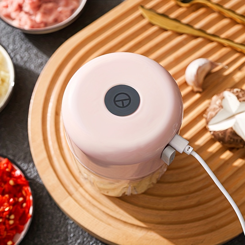 3 color options compact electric garlic press for home and restaurant use with stainless steel blades quickly crushes garlic and ginger ideal for   food preparations Product details 1