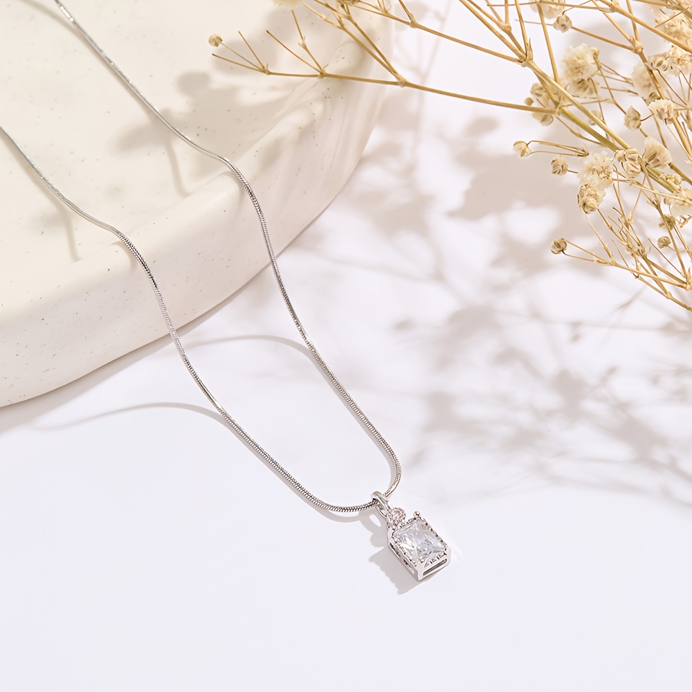Image of A Versatile Stainless Steel Round Snake Bone Chain Square Copper Micro-inlaid Sparkling Zirconia Clavicle Pendant Necklace For Women