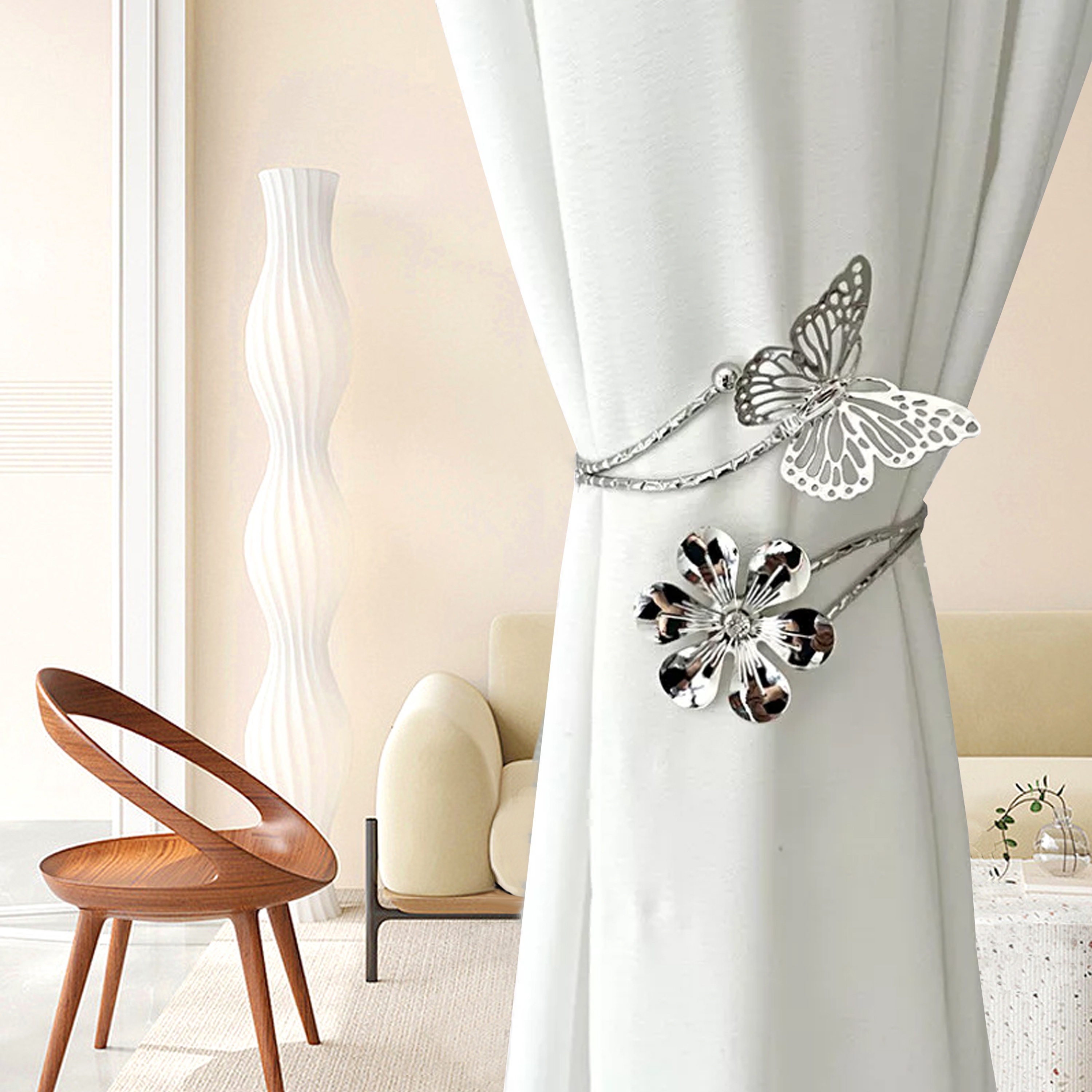 two golden silvery butterfly and flower shaped curtain tiebacks featuring a modern minimalist style with creative hollow     adjustable curtain holders     without drilling suitable for living room bedroom office home decor   a warm feeling to your home details 10