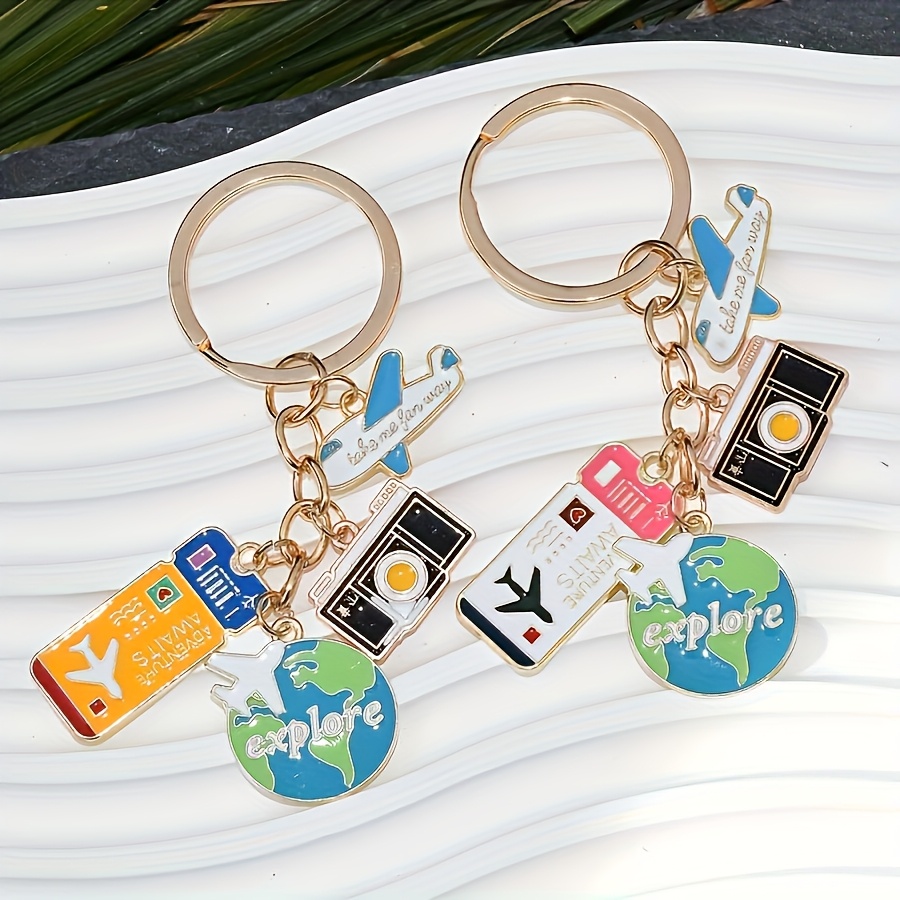 TEMU A Travel-themed Keychain Featuring An Airplane,, And A Yellow/oil-painted With A Five-ring Design, Perfect For Bags, Backpacks, And Car Additions, Making It An Ideal Gift For Travel Enthusiasts