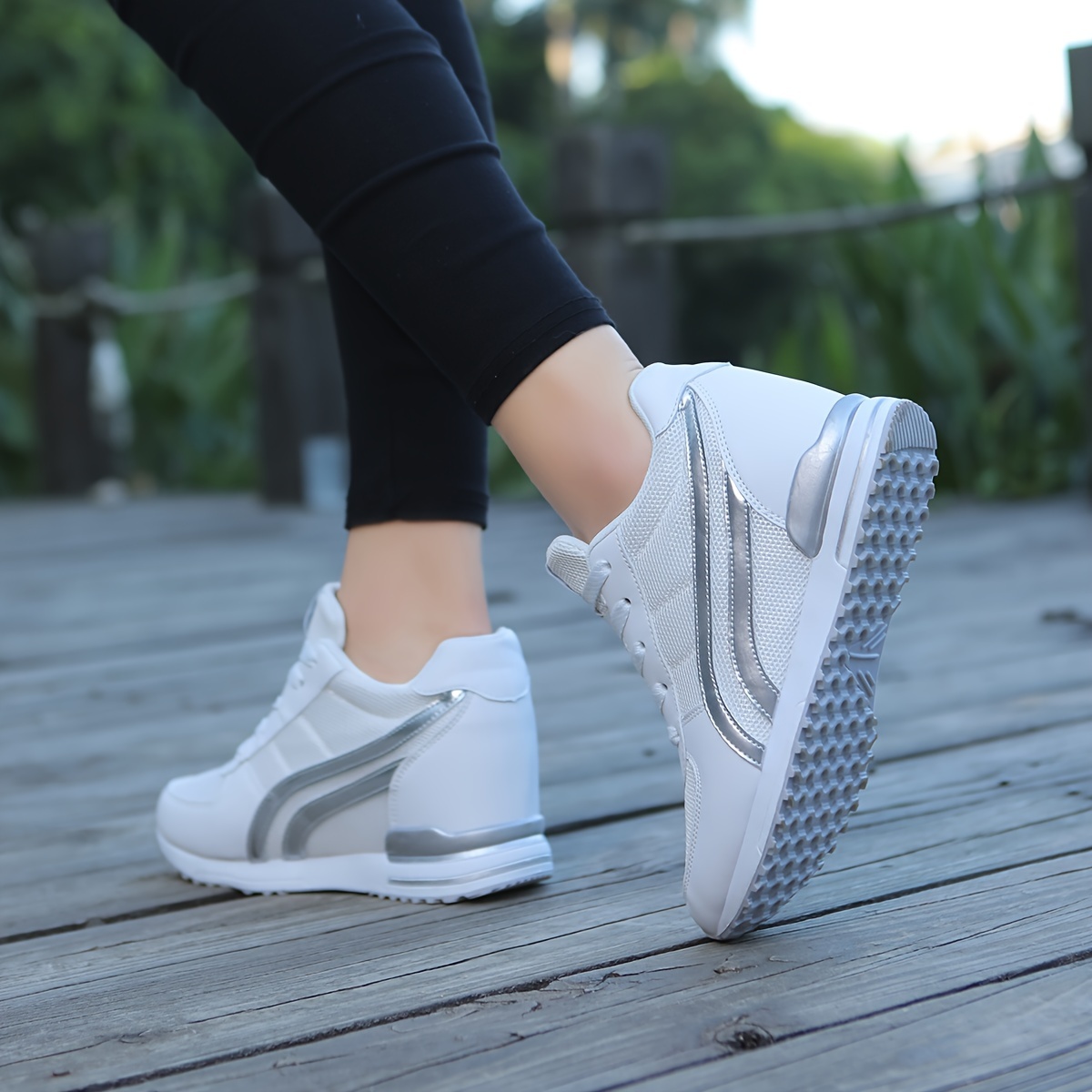 White ladies wedge sneakers sold by 100 Spartans