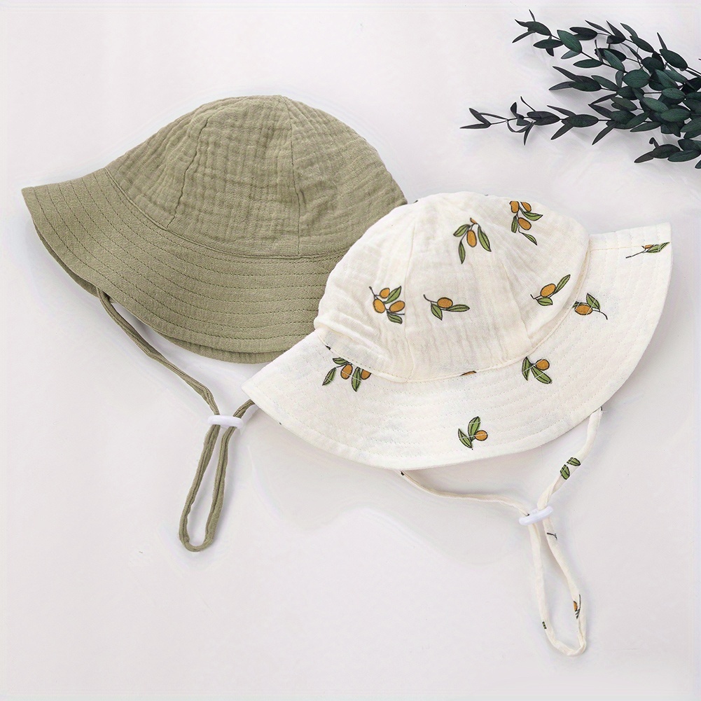 Image of 2pcs, New Boys' Outdoor Cute Fisherman Hat, Spring And Floral Solid Color Baby Basin Hat 2 Combination Sets, Soft And Foldable With Windproof Lace Up Cartoon Printed Hat