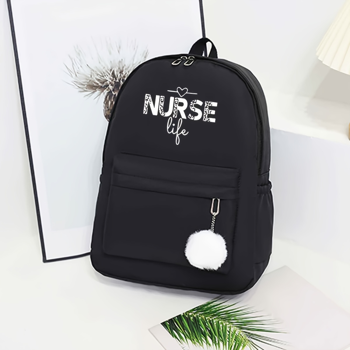 

Minimalist Nurse Life Printed Backpack With Pom Pom Charm - Polyester Dual-shoulder Bag For Women, Students - Practical & Stylish Black Backpack For Everyday Use - Baigou Craftsmanship