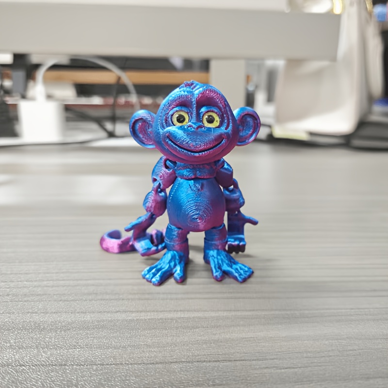Image of A 3d Printed Monkey Figurine With Movable Joints, Vibrant Colors, And Random Eyes, Suitable For Children Aged 3 And Above