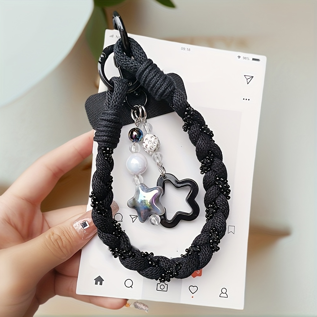 Image of Short Phone Lanyard With A Stylish Pendant, Wrist-length Design For Outdoor Use, And A Protective Strap To Prevent Dropping The Phone.