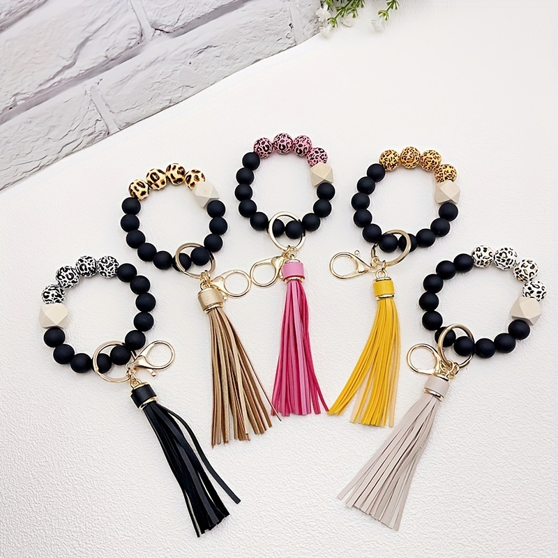 

1pc Leopard Silicone Wooden Beaded Wristlet Keychain With Pu Leather Tassel Fashion Bag Charm Phone Lanyard Bangle Keychain Women Daily Uses Gift