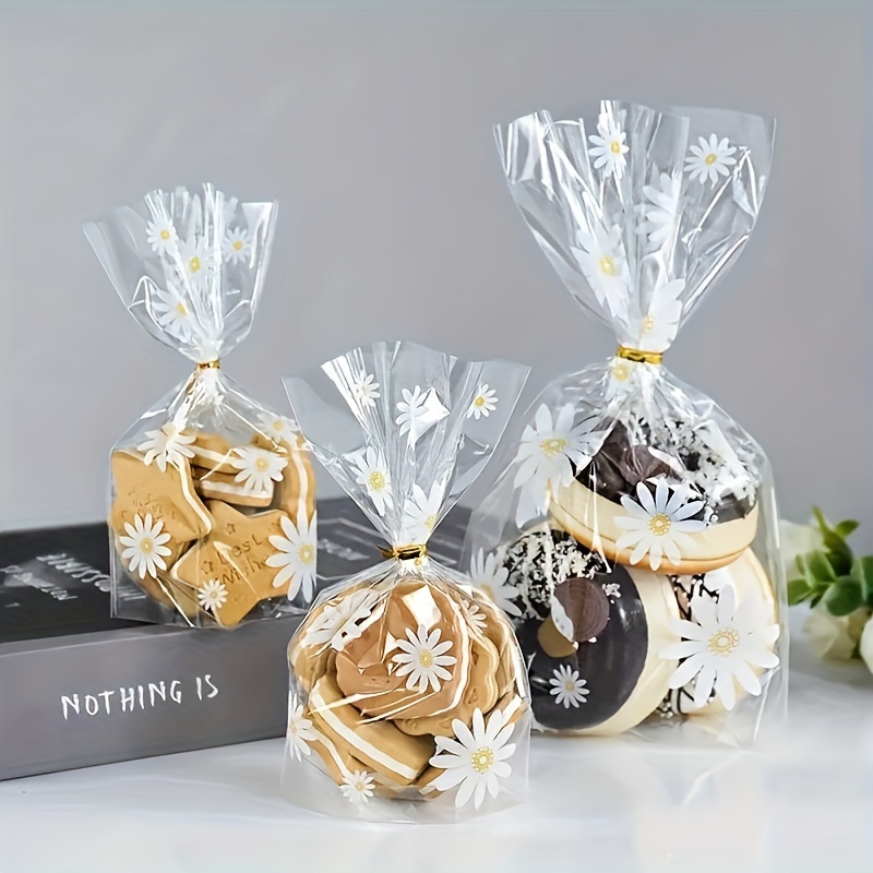 

50/100pcs Storage Bags, Daisy Candy Opp Biscuit Bags, Food Packaging Bags With Golden Twist Ties, Transparent Cookie Baking Packaging Bag, For Wedding, Party And Holiday, Kitchen Supplies