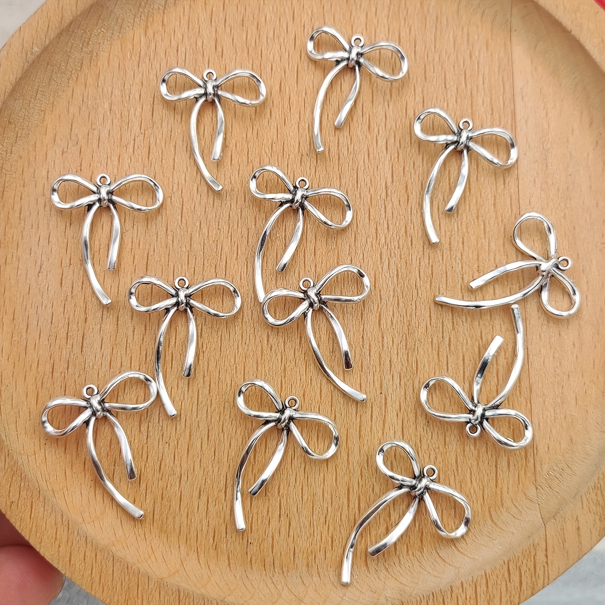 Set Of 12 Shiny Christmas Bow Charms For Jewelry Like Necklaces, Bracelets, And Earrings