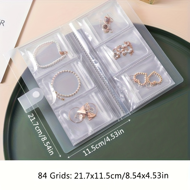E-shop 84-Fächer Mehrzweck Tragbarer Schmuckaufbewahrungsordner aus Kunststoff, Reiseschmuck-Organizer, Geeignet für Ohrringe, Ringe, Halsketten -