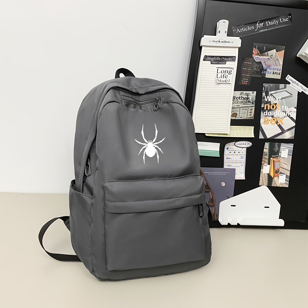 

Nylon Casual Daypack With Spider Emblem, Large Capacity, Adjustable Straps, Zip Closure, Polyester Lined, Sewing Thread Detail, With Positioning For School And