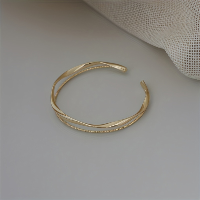 TEMU This Minimalist Vintage-style Open Bangle Features An Elegant And Fashionable Design With An Irregular Möbius Double-layer That Adjusted. It's A