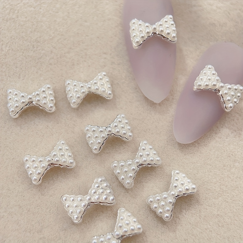 

10pcs All-pearl Bow Nails Accessories Three-dimensional Alloy Silvery Bow Tie Nail Supplies Beautiful Lady Girl Nail Charms Crafts Mobile Phone Case Diy