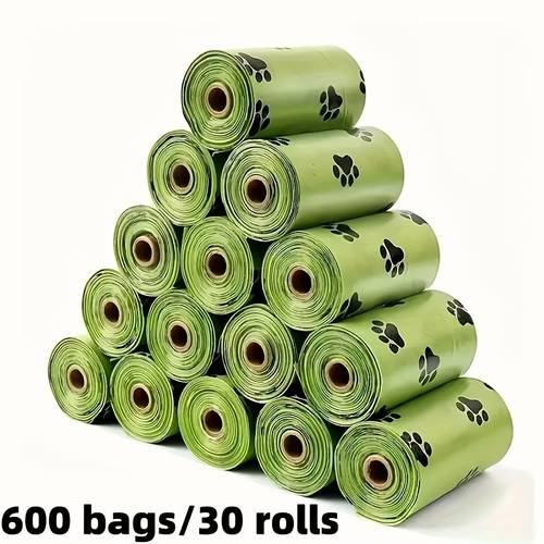 leak resistant dog waste bags featuring a paw print design in packs of 600pcs with 30 rolls 400pcs with 20 rolls and 200pcs with 10 rolls for outdoor pet