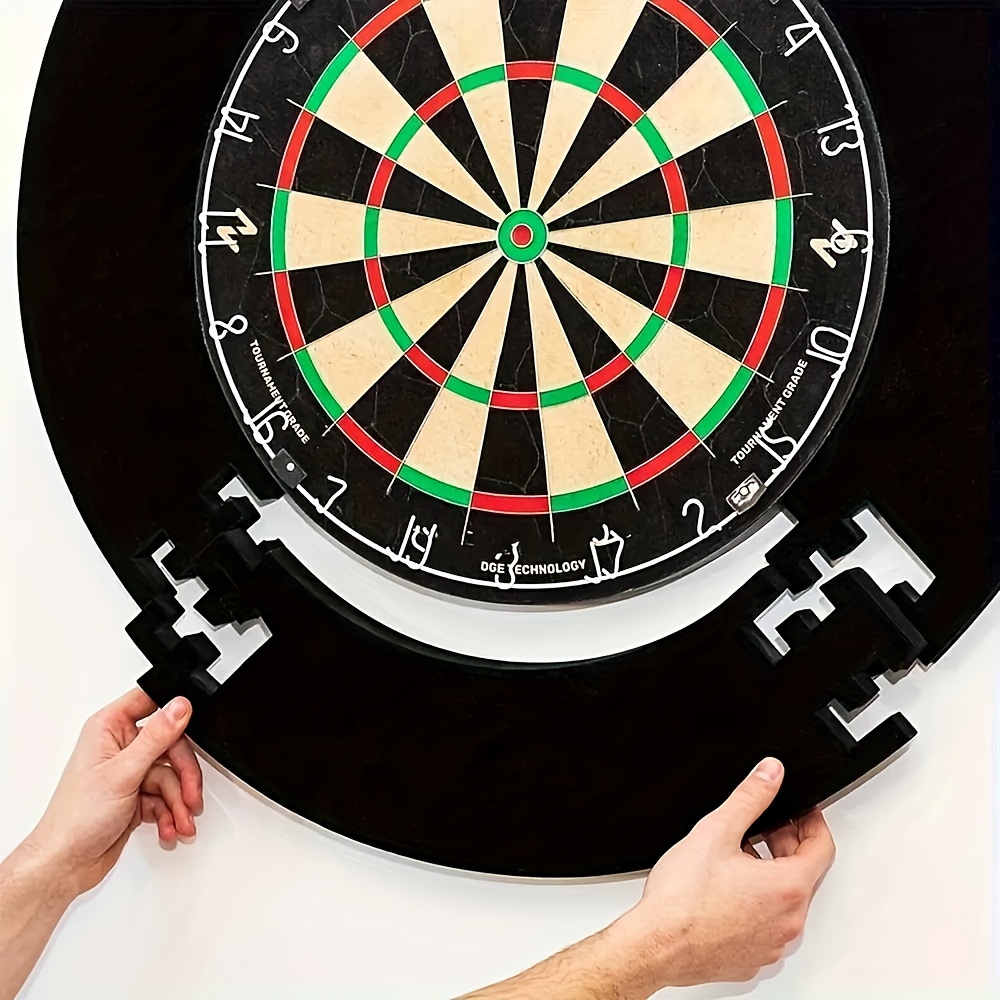 A Black Dartboard Holder Made of EVA Foam for Wall Decoration, Featuring a Protective Pad That Easily Snaps Onto a Standard Dartboard. It Includes a Easy-To-Install Protective Ring And Can Serve As a Wall Sticker, Making It a Great Gift for Parents