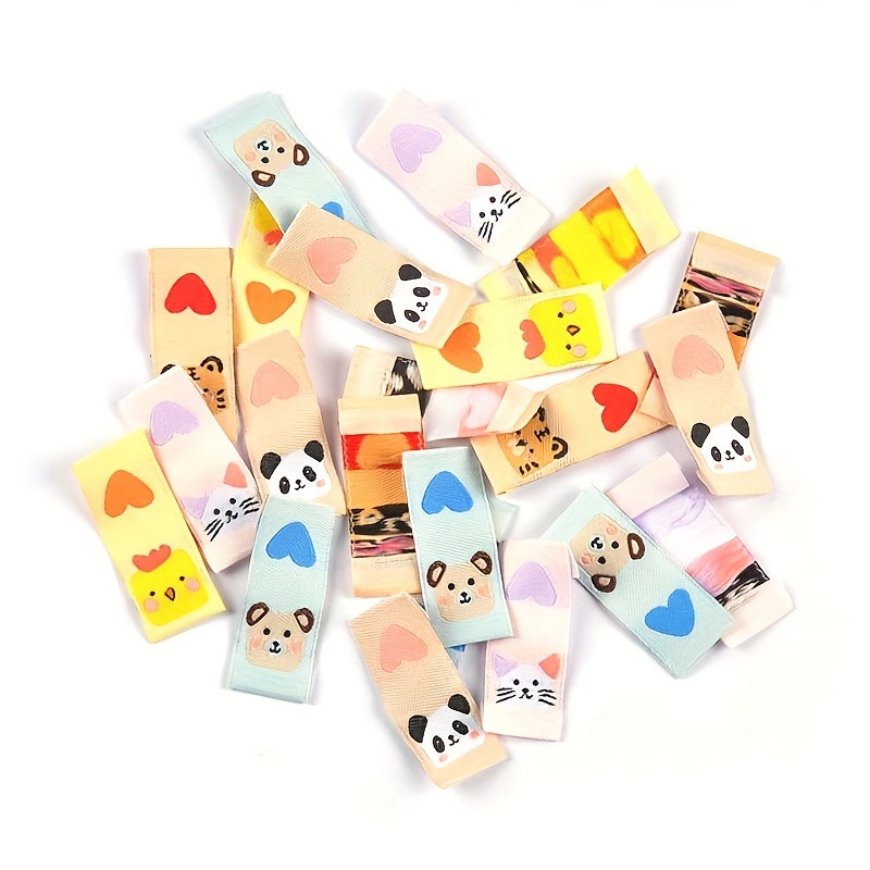 Image of 50pcs 1.5*4cm Fabric Labels, Clothing Collar Tags, Fabric Patches With Random Mixed Animal And Heart Patterns, Handmade Sew-on Diy Garment Accessories