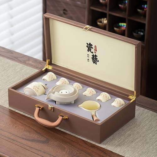 a set of creative wisteria flowers a lazy fu tea set for home use featuring automatic rotation for brewing tea and heat protection in a gift box this fu tea set is suitable for home office and reception areas