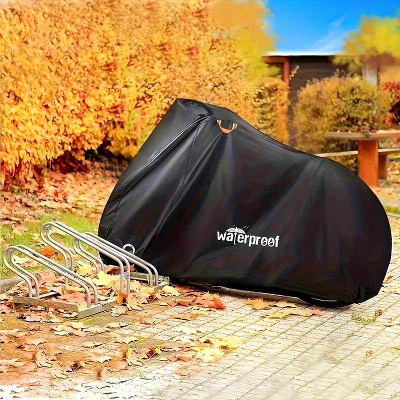a waterproof bike cover specifically designed for bicycles made of 210t oxford fabric with a bike storage bag providing protection against wind snow and dust suitable for beach bikes sports bikes mountain bikes and road bikes details 2