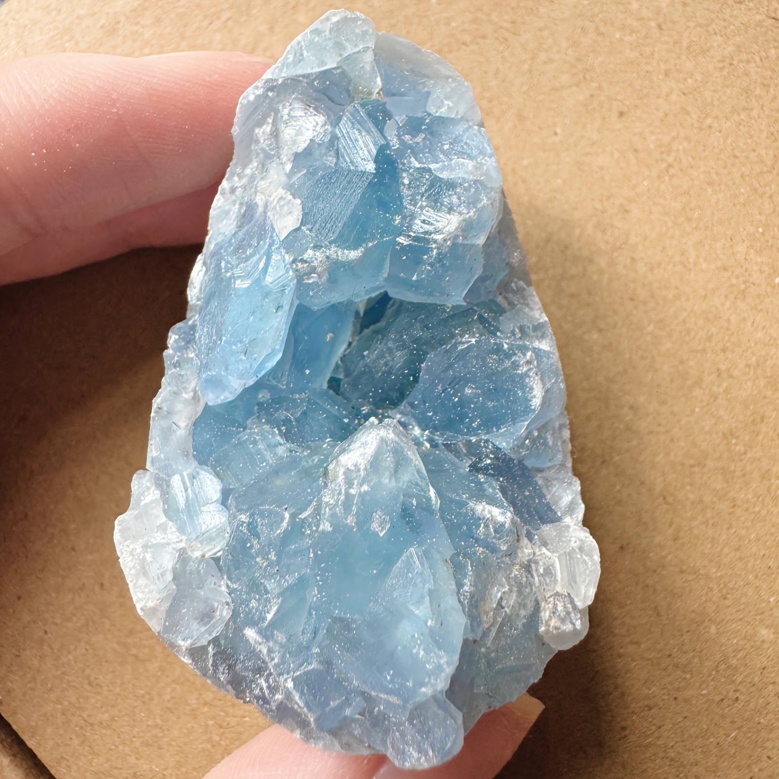 Image of Stone Egg-shaped Crystal, Containing Clusters. The Color Of This Geological Stone Resembles The Blue Of The Sky, Making It Ideal For Home And Office Decoration
