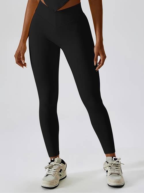 high waisted tight fitting sports pants for women featuring and pockets designed to enhance the peach shape